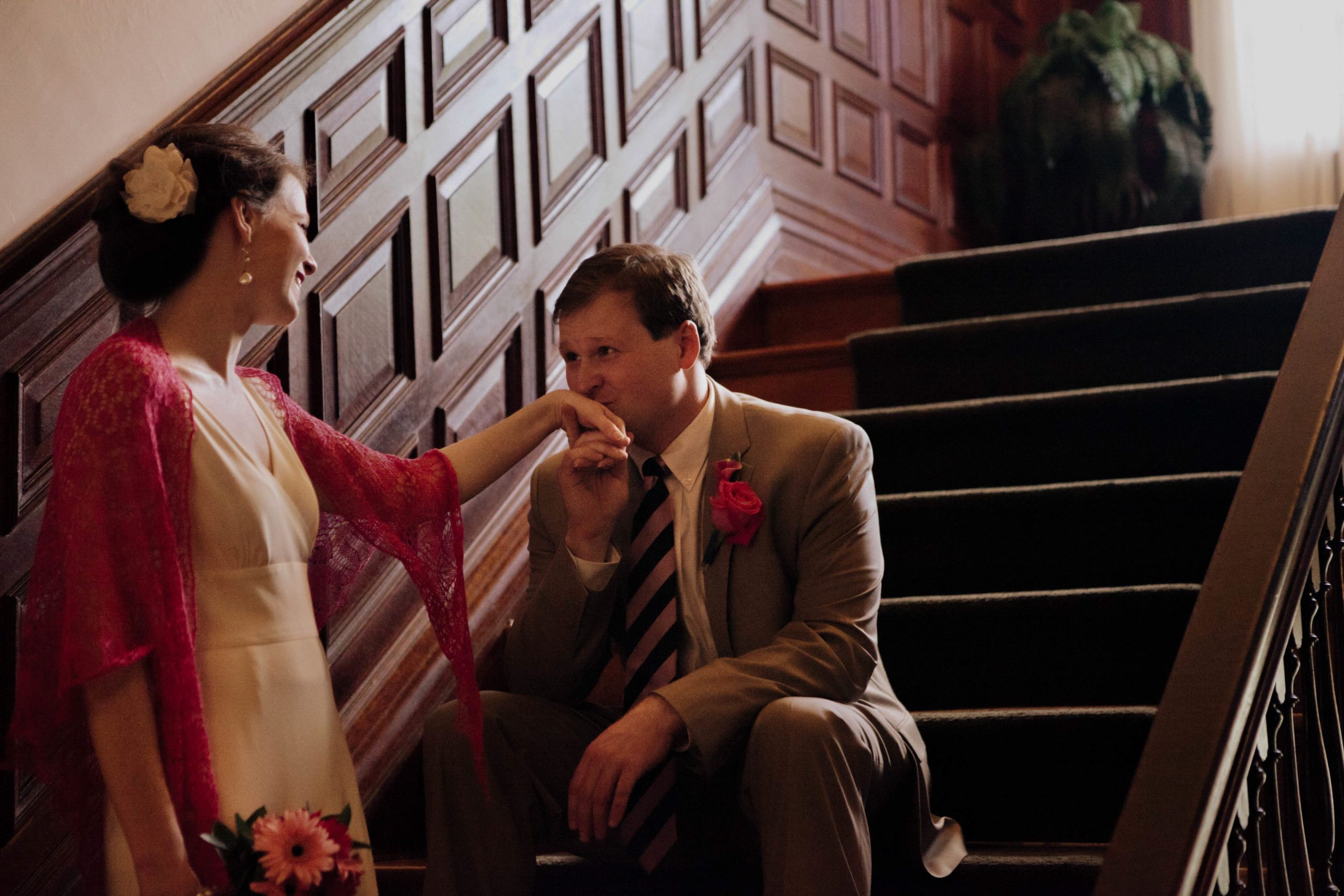 groom kissing brides hand