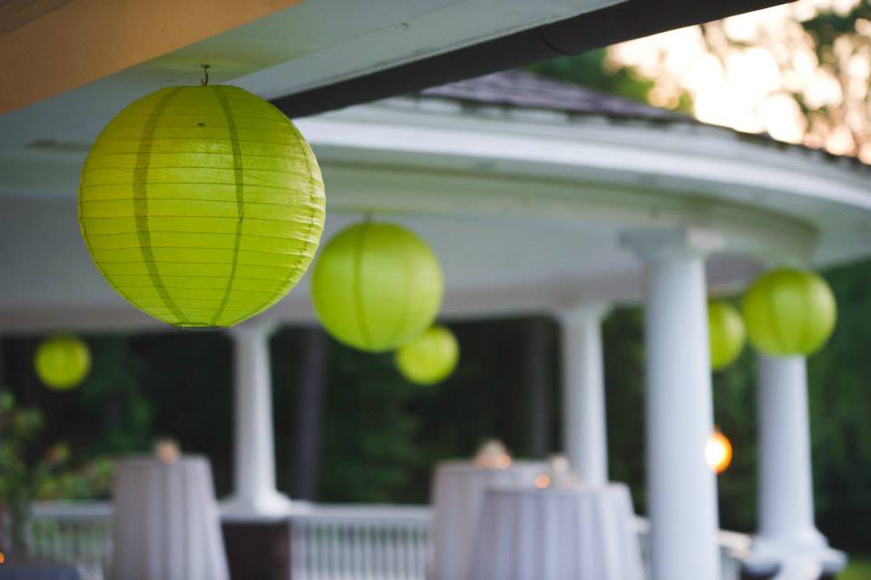 lime green chinese lanterns hung up on the veranda