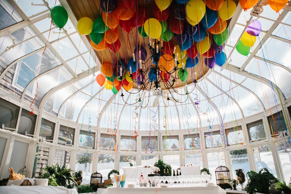 balloons floating on the ceiling of the glass conservatory