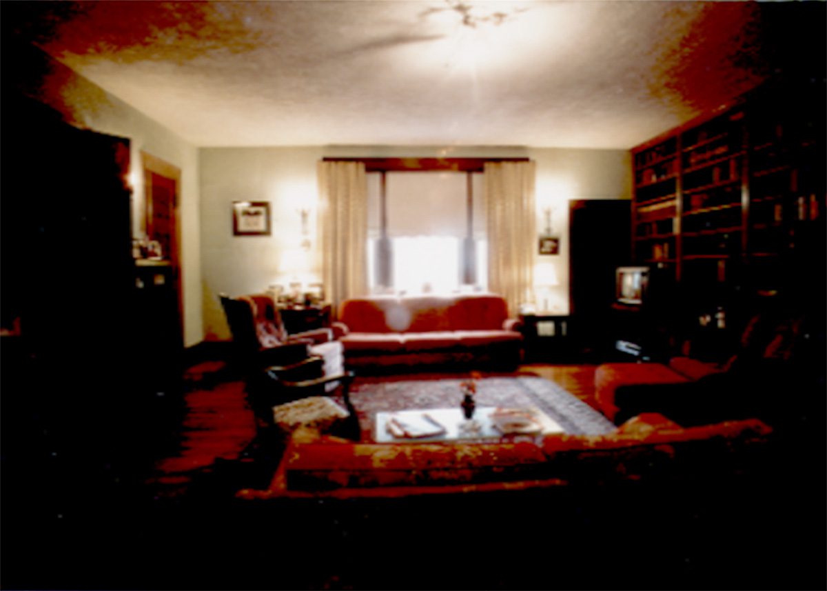 heathstone-castle-living-room-in-reds-and-dark-wood