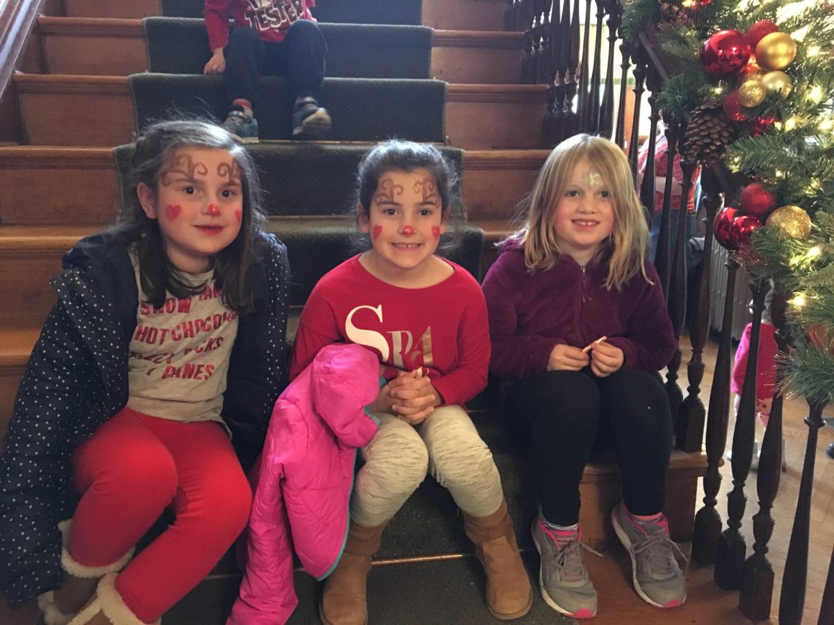 candy-cane-fundraiser-three-young-girls-sit-for-a-break-on-stairs