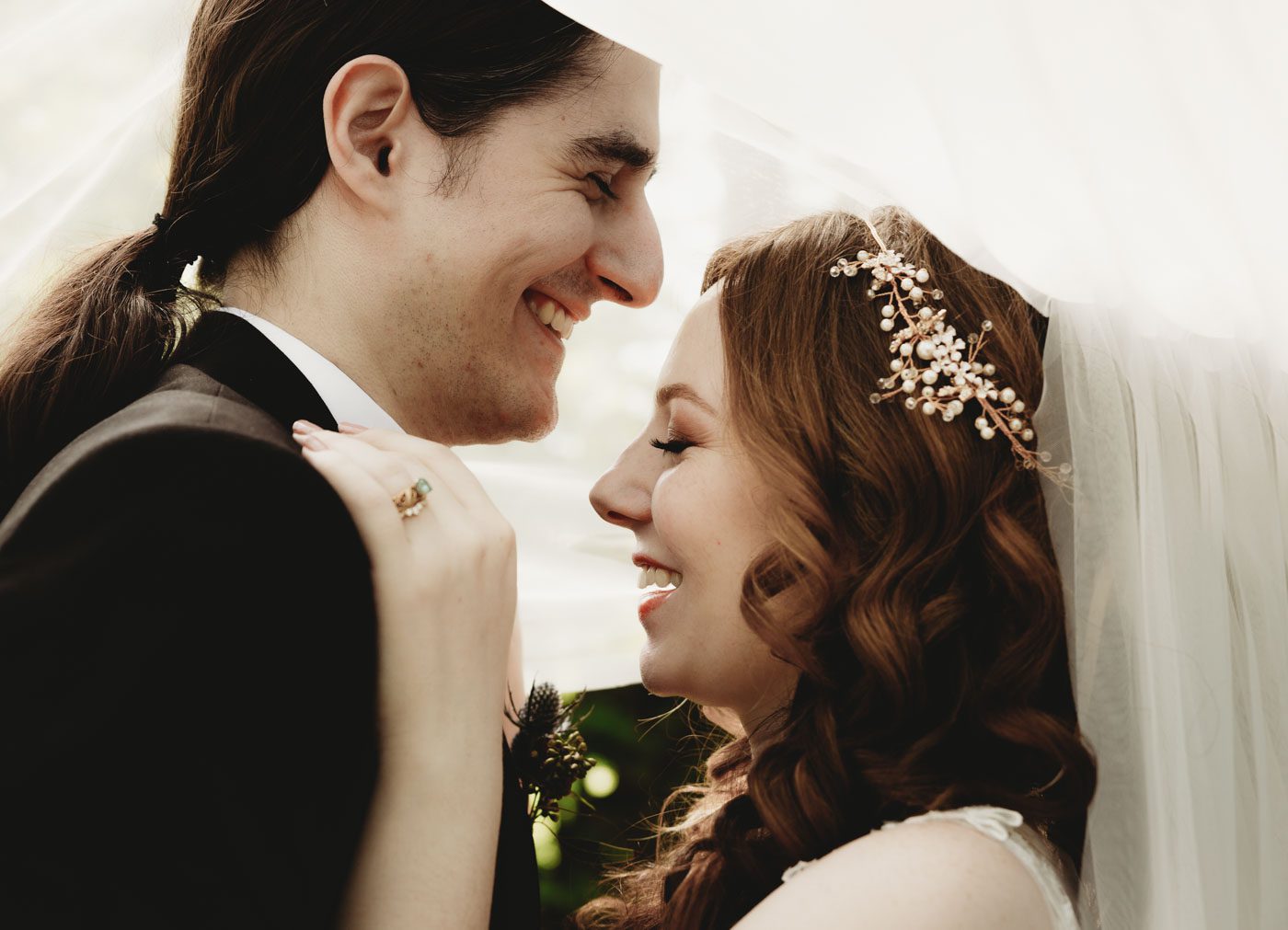 gazebo-wedding-couple-arm-in-arm-laughing