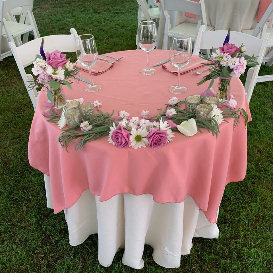 july-tent-wedding-head-table-pink-with-flowers